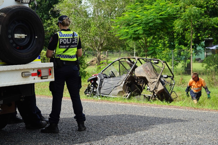 A photo shows a police officer with 'crash investigations' on their back in from of a crashed ATV.
