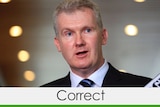 Tony Burke with a banner saying 'correct'
