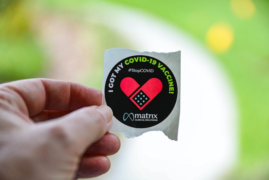 Black sticker featuring red heart-shaped Bandaid and the words 'I got my COVID-19 vaccine!'