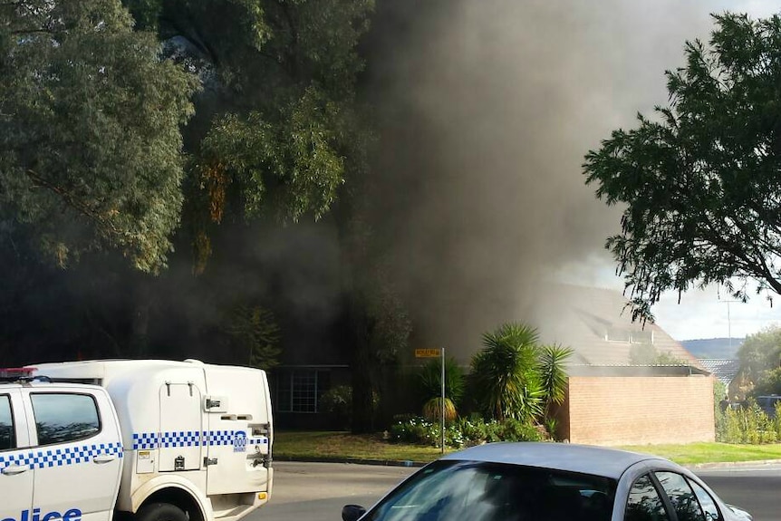 Smoke billows from a burning home at Penrith.