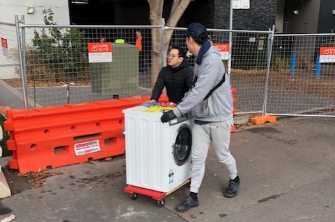 Mascot Towers residents remove their belongings from the troubled apartments on June 23, 2019.