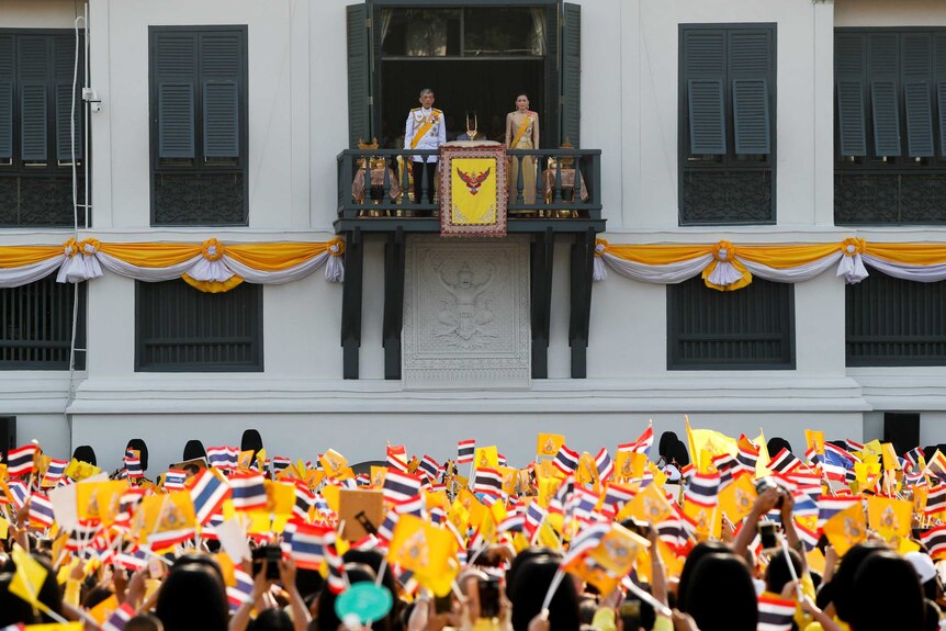 Thailand's newly crowned King Maha Vajiralongkorn and Queen Suthida are seen at the balcony of Suddhaisavarya Prasad Hall at the Grand Palace, Bangkok