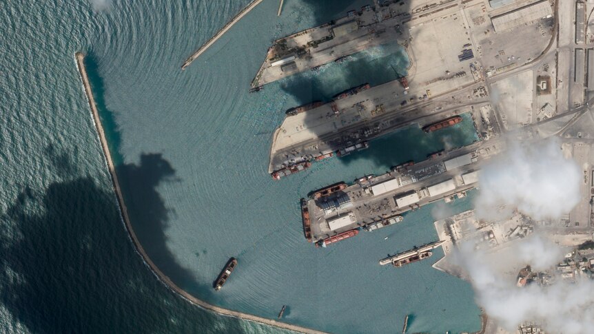 A satellite image shows cargo ships leaving from a Syrian port.