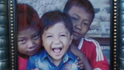 Faris (centre) was killed by diphtheria, an infectious disease breaking out across Indonesia. (Image: ABC News/Adam Harvey)