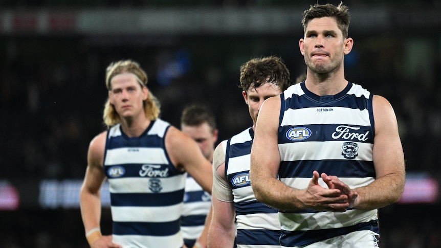 Geelong AFL players walk off the field following a loss to St Kilda/