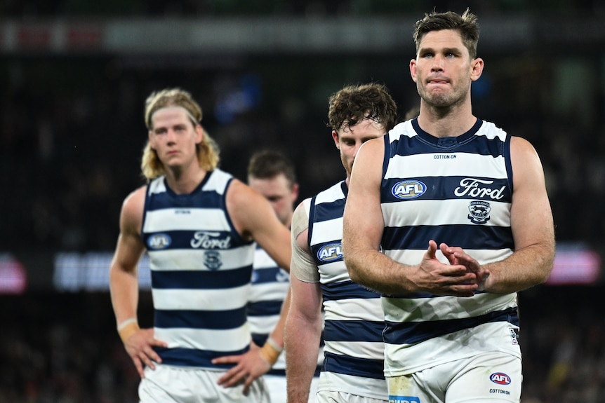 Geelong AFL players walk off the field following a loss to St Kilda/
