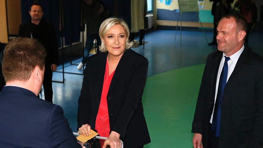 French far-right presidential candidate Marine Le Pen casts her ballot in the presidential election.