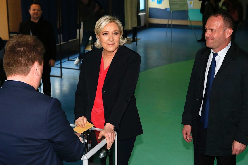French far-right presidential candidate Marine Le Pen casts her ballot in the presidential election.