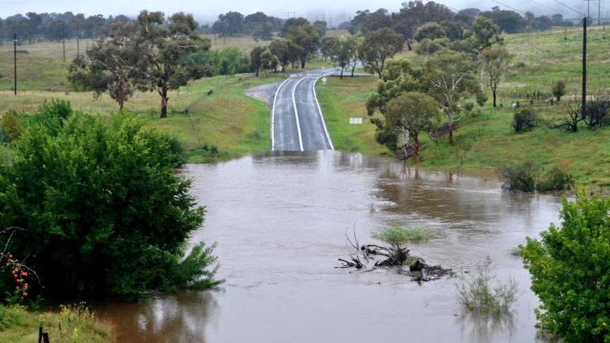 A road is submerged by floodwaters near the News South Wales town of Queanbeyan on March 1, 2012.