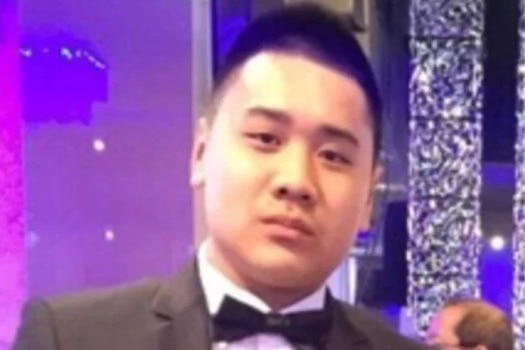 Nathan Tran in a suit