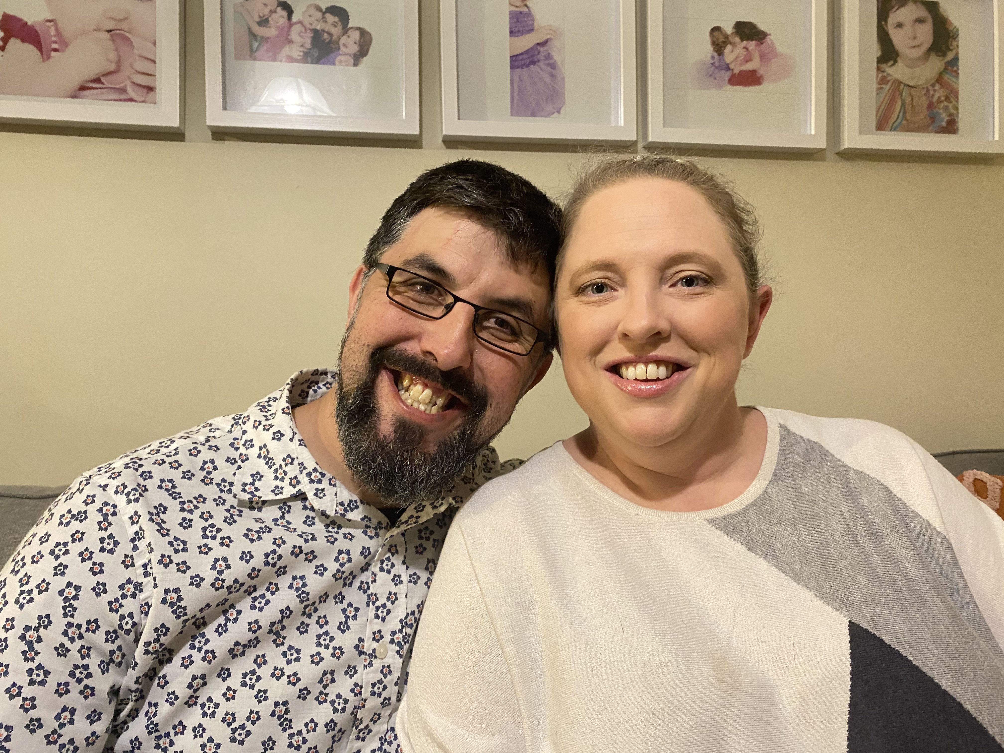 Man and woman smiling in their home, in a story about what to do when you're priced out of buying property.