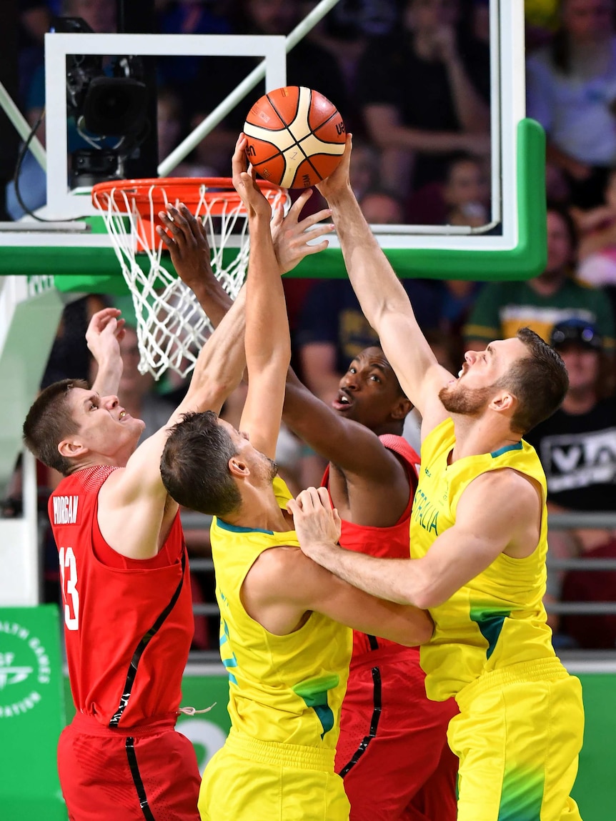 Australia's Nick Kay reaches up for the ball against Canadian opponents