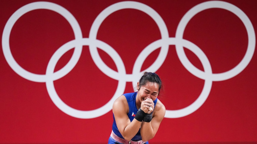 Hidilyn Diaz of Philippines cries after winning the Women's 55kg Weightlifting Group at the Tokyo 2020 Olympic Games