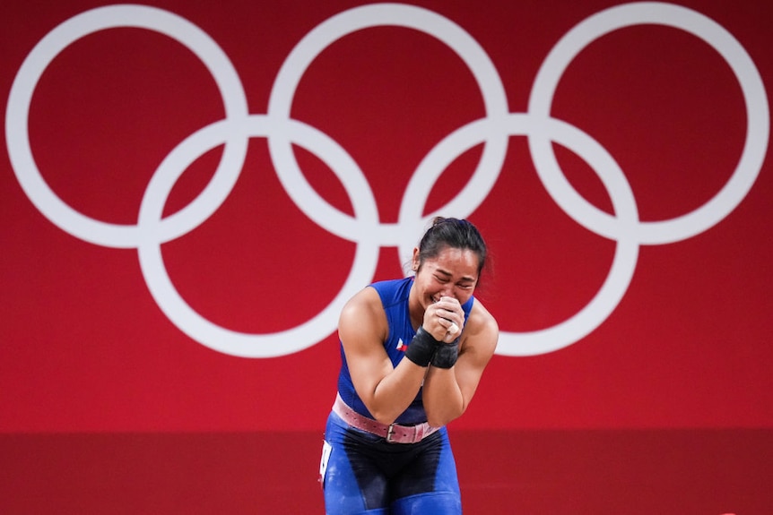 Hidilyn Diaz of Philippines cries after winning the Women's 55kg Weightlifting Group at the Tokyo 2020 Olympic Games