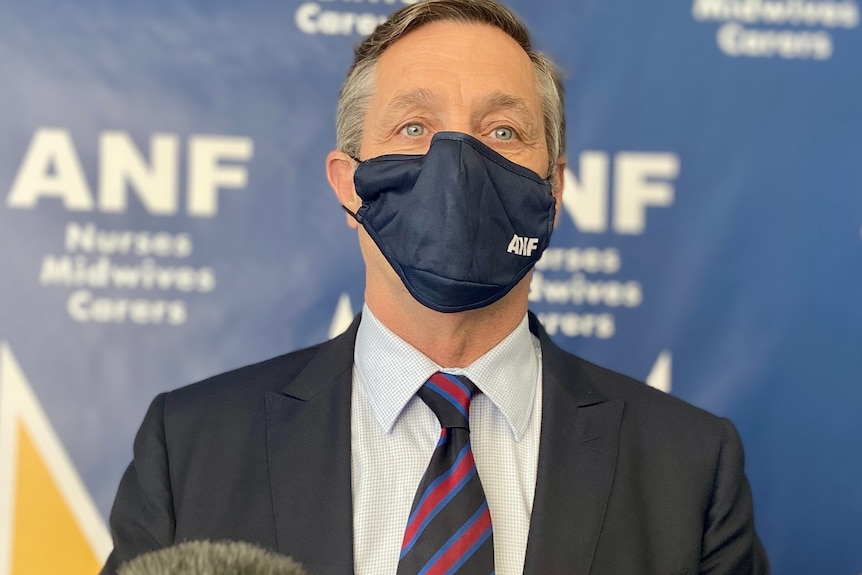 ANF state secretary Mark Olson wearing a mask.