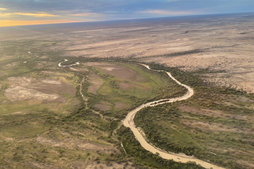 An aerial shot, taken from a plane, shows land and water in Channel Country