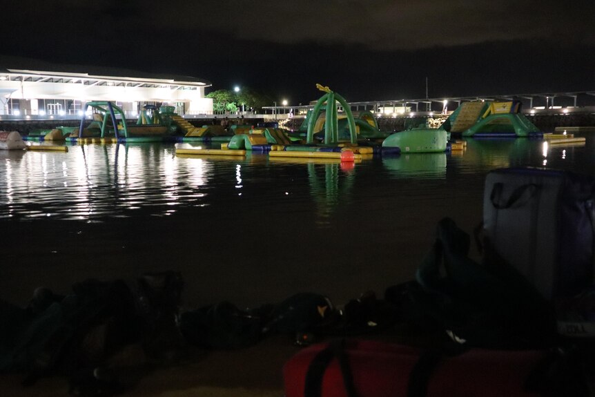 an inflatable water park at night time