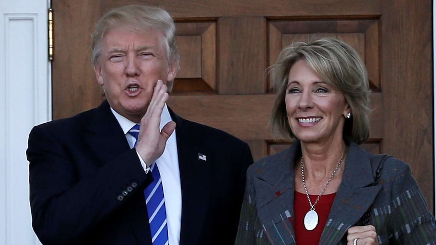 Education Secretary Betsy DeVos (right) with Donald Trump.