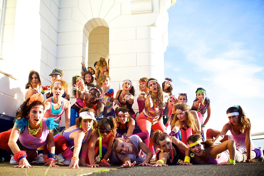 Dance troupe The Cassettes pose at the Byron Bay lighthouse