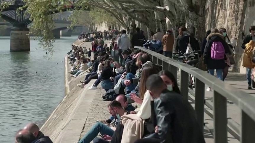 Parisians seek fresh air and sunshine on Seine riverbanks amid lockdown