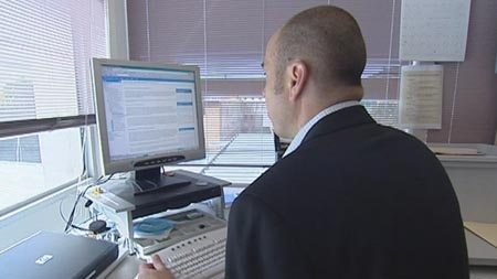 generic man sitting at computer