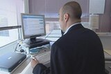 generic man sitting at computer