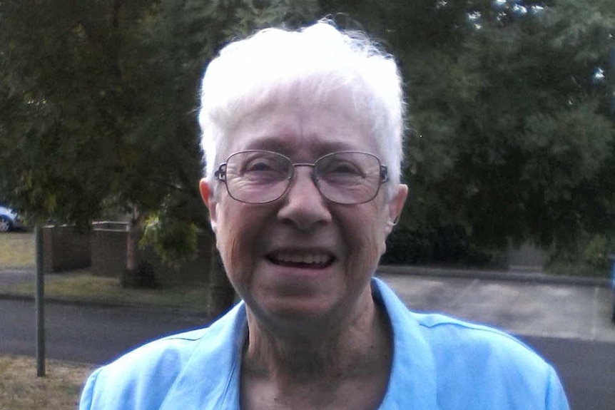 A woman in a blue outfit.