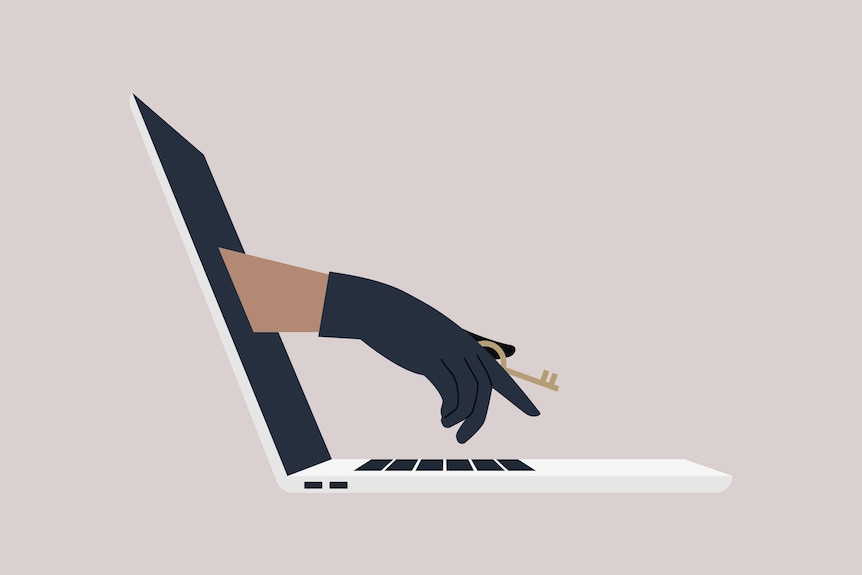 A hand in a black leather glove holding an access key reaching through a laptop screen.