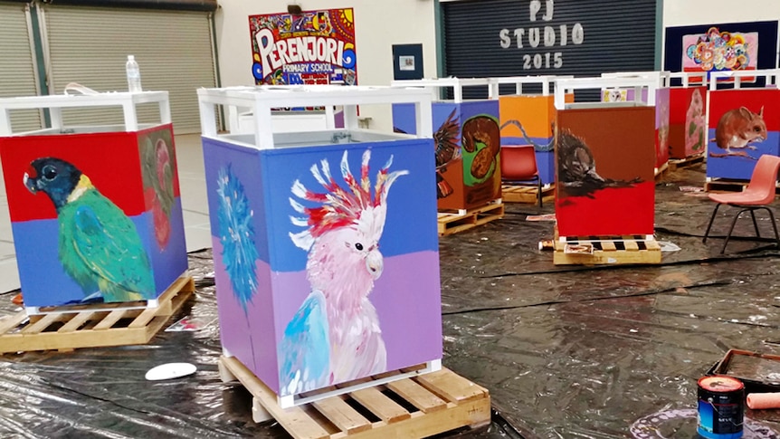 Rubbish bin containers painted and nearly ready in a studio