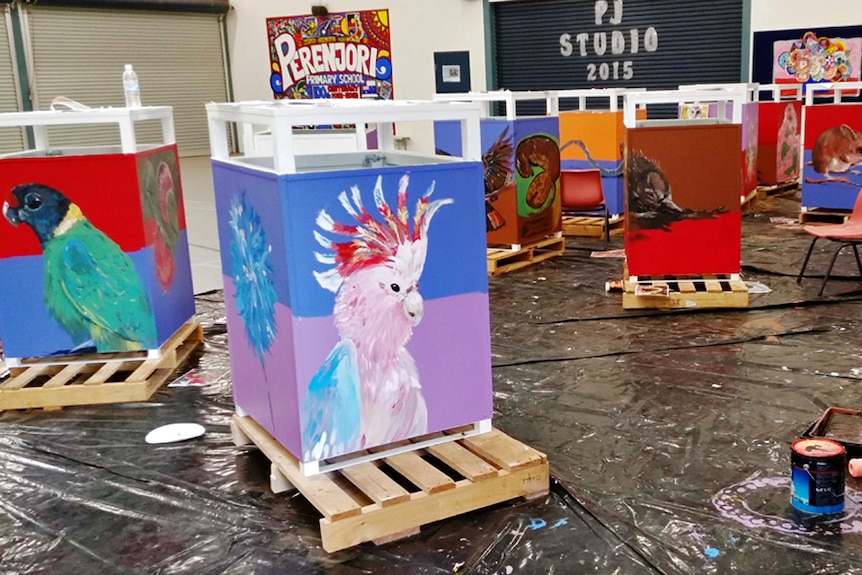 Rubbish bin containers painted and nearly ready in a studio