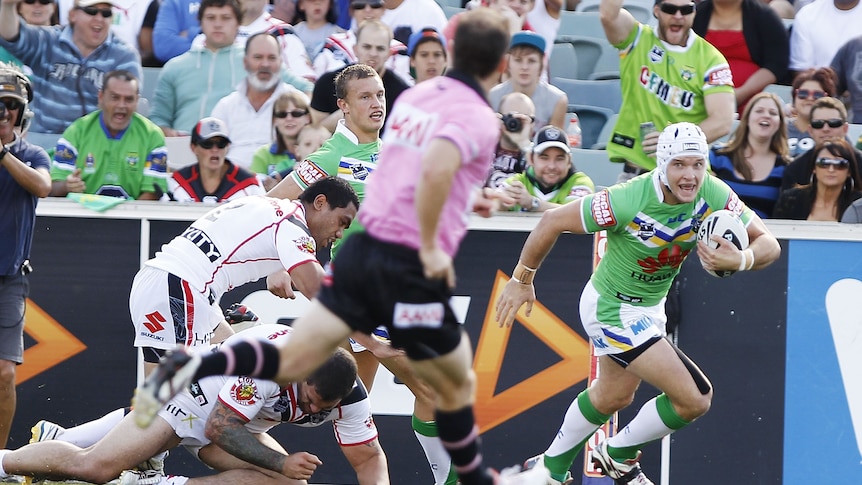 Green Machine rolls on ... Jarrod Croker evades the Warriors for his first of two tries.