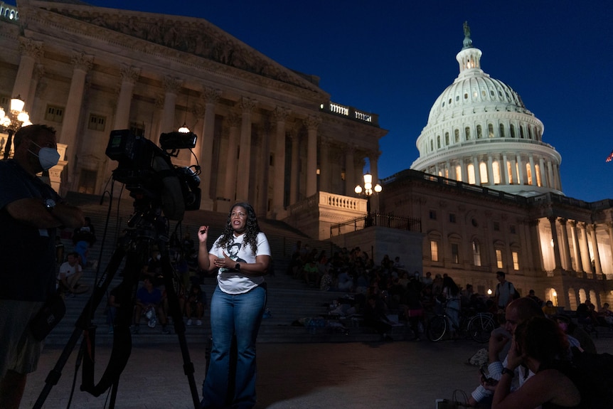 Rep. Cori Bush, D-Mo., speaks during an interview as she camps outside the U.S. Capitol