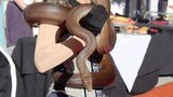brown snake wrapped around woman's shoulders