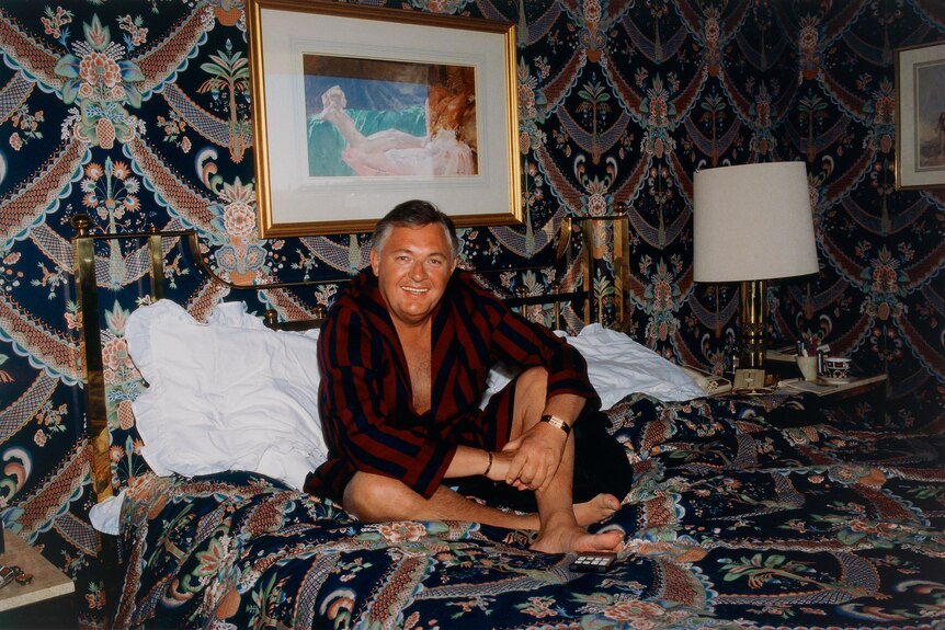 Alan Bond on his bed in 1985