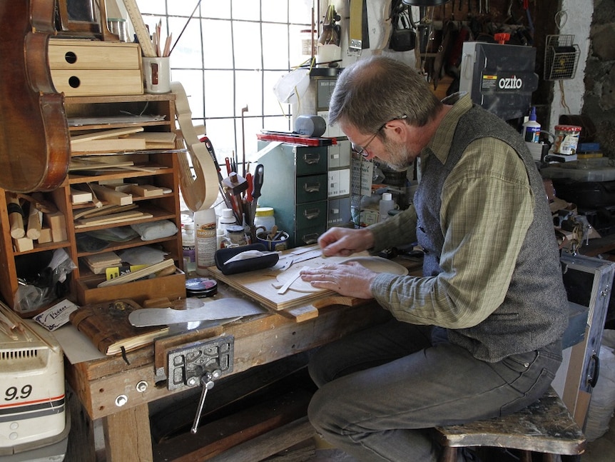 Martin Scuffins making a Hardanger fiddle in his workshop.