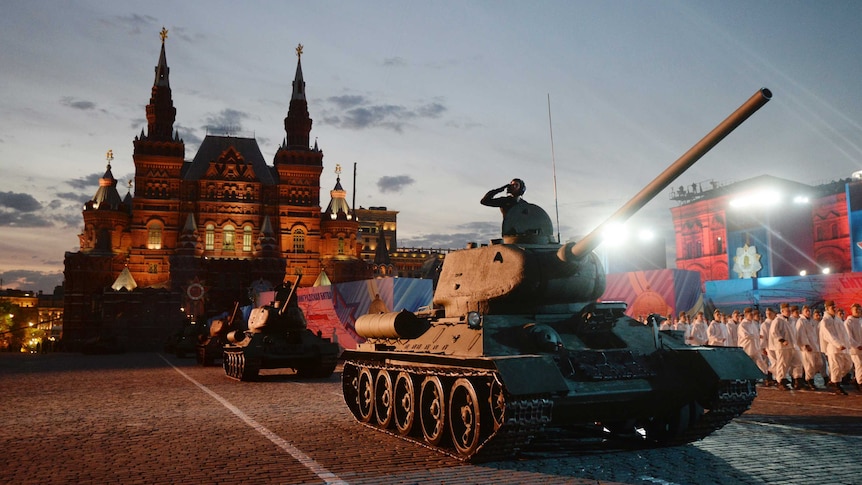 Soviet World War II T-34 tanks drive during VE Day celebrations
