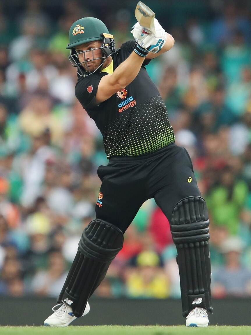 An Australian batsman watches a shot he plays to the off side against Pakistan in a Twenty20 international.