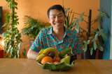 Melbourne fruiterer Thanh Truong smiles while sitting in front of a fruit bowl.
