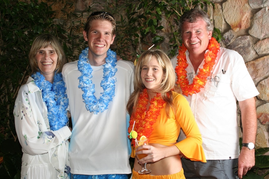 Shelley Beverley and her family wearing leis to celebrate her 21st birthday