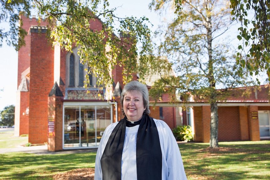 Reverend Sue Willis stands outside St Stephen's Anglican Church Wynyard