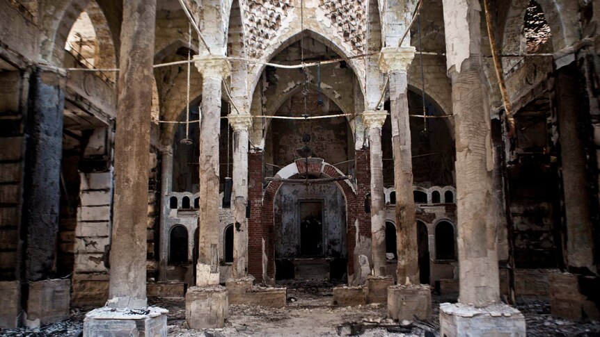 Ash and debris is scattered inside the Amir Tadros Coptic church near Cairo