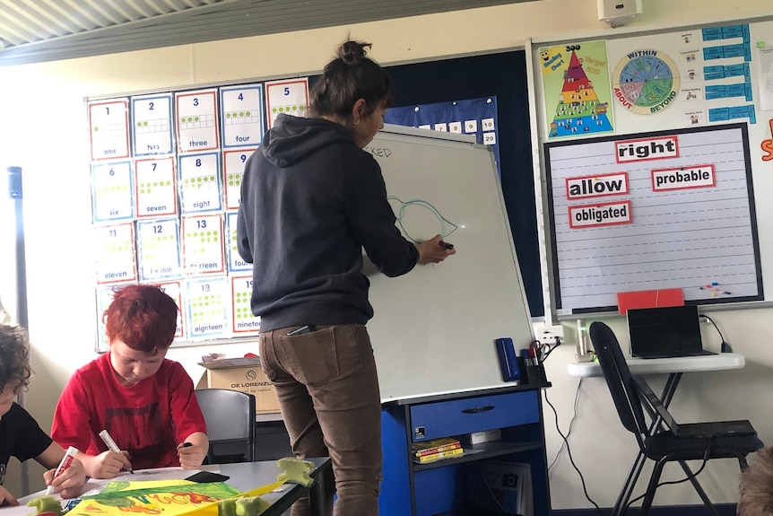 Amellia Formby drawing a bird on a whiteboard