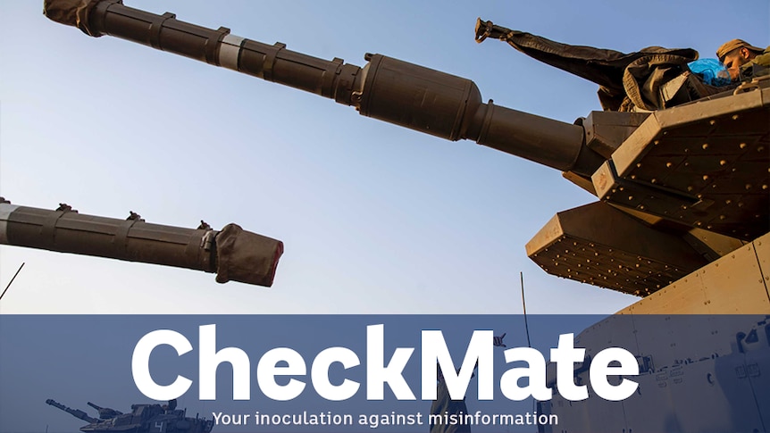 two turrets of tanks against a blue sky. a blue graphical banner is present underneath which says CHECKMATE