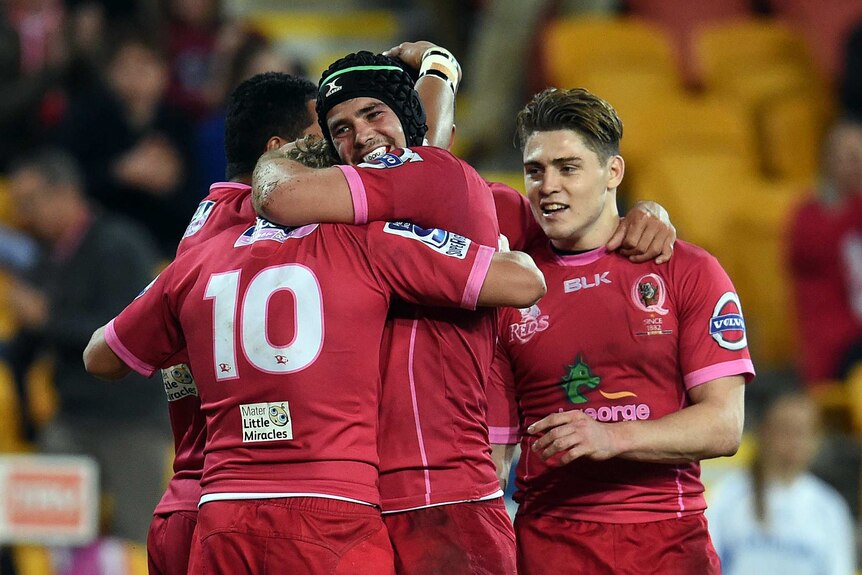 Queensland Reds celebrate a try