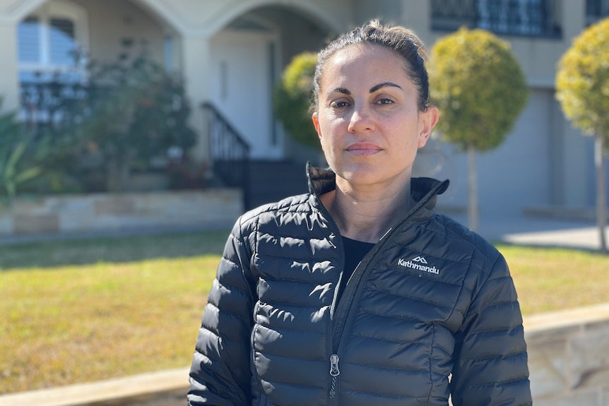 A woman wearing a black puffy jacket