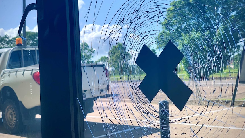 A smashed window taped with gaffer tape