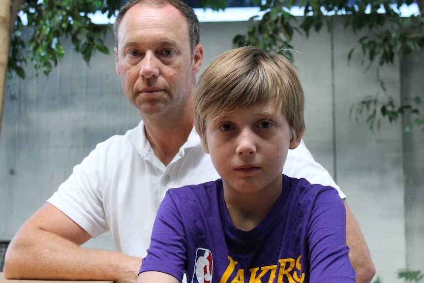 portrait shot of Justin and son Kai out in the garden