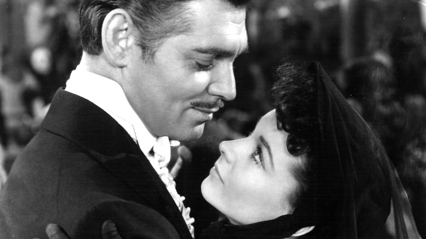 Clark Gable as Rhett Butler and Vivien Leigh as Scarlett O'Hara embrace in Gone with the Wind