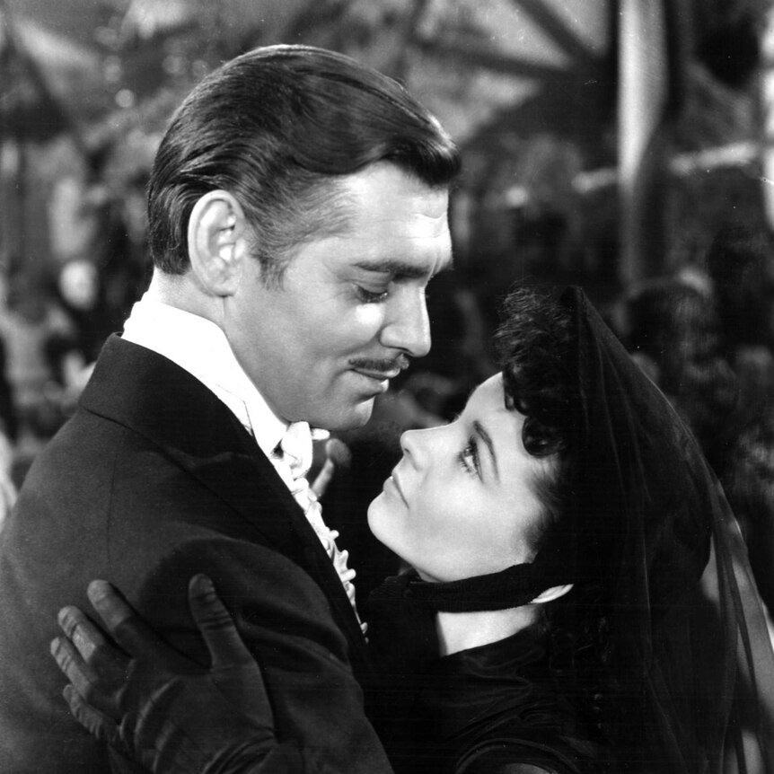 Clark Gable as Rhett Butler and Vivien Leigh as Scarlett O'Hara embrace in Gone with the Wind