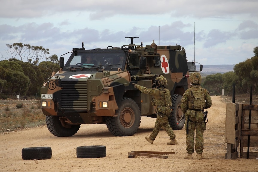 An Australian Army bushmaster with a red cross painted on the side in a military training field area near Adelaide in 2016.